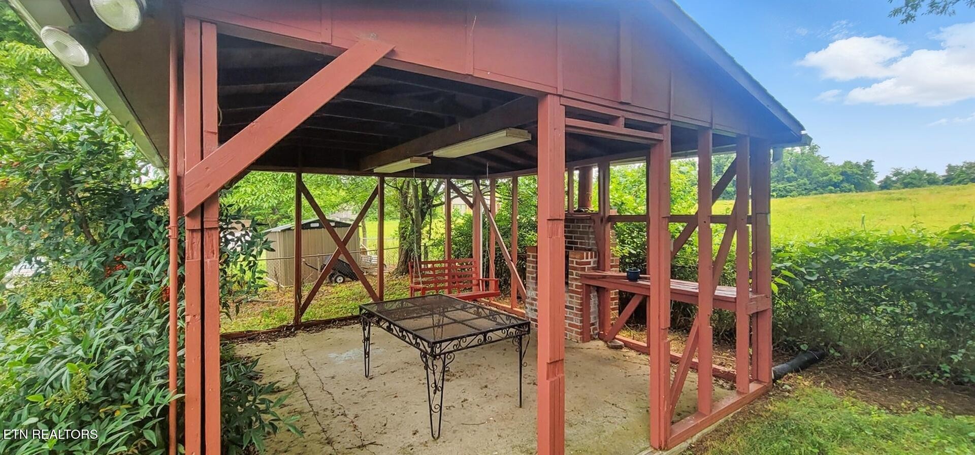 4004 Deerfield Road Knoxville, TN 37921 - Photo 27 of 34 a view of balcony with two chairs and a table