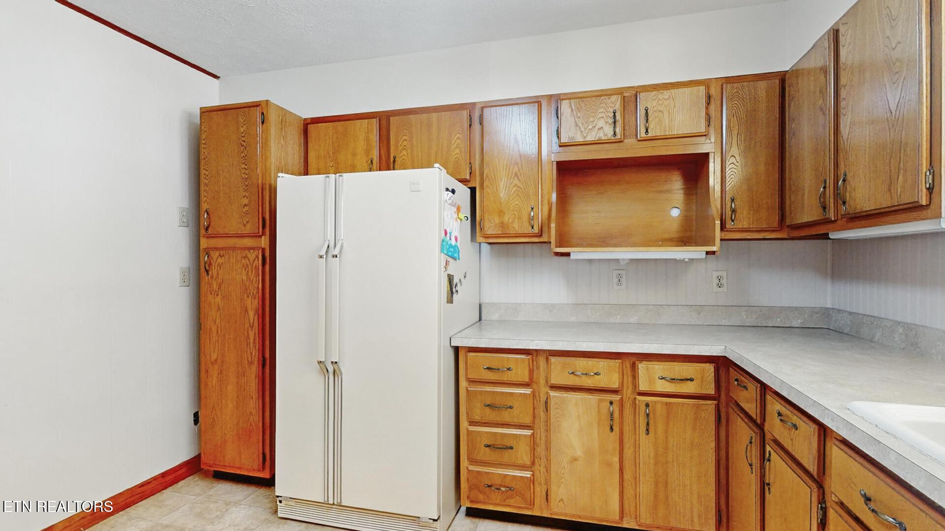 4004 Deerfield Road Knoxville, TN 37921 - Photo 10 of 34 a white refrigerator freezer sitting inside of a kitchen