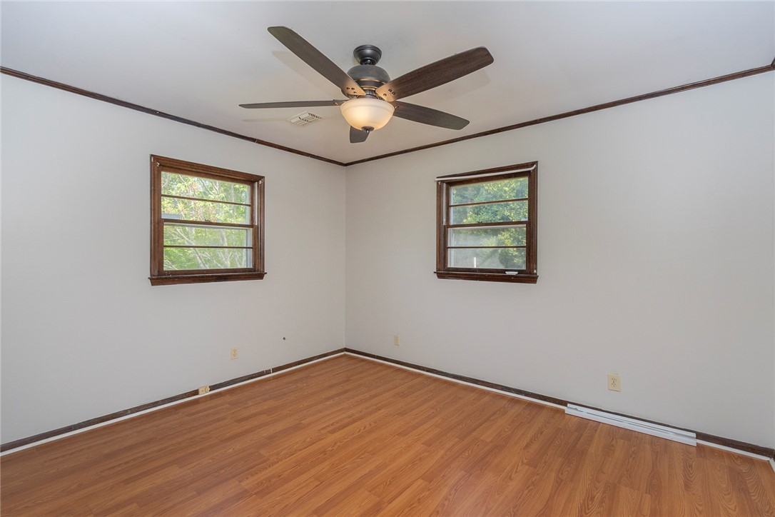 820 Travis Road Anderson, SC 29626 - Photo 34 of 46 This spacious room features ample natural light and durable flooring, offering versatile living options.