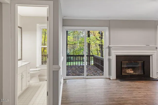 a bathroom with a double vanity sink and mirror with shower