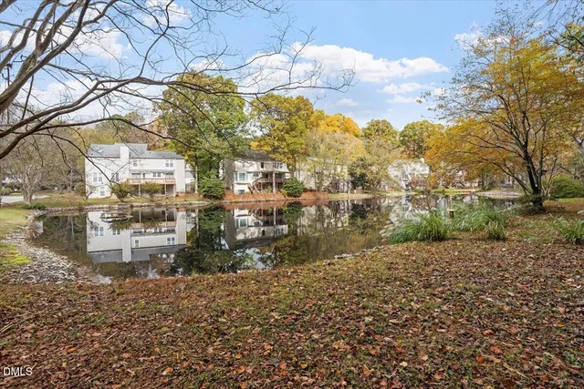 a view of a porch with a floor to ceiling window next to a yard