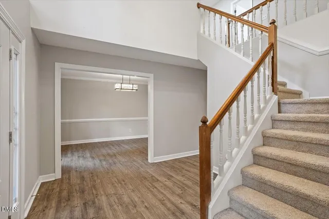 a view of an entryway with wooden floor