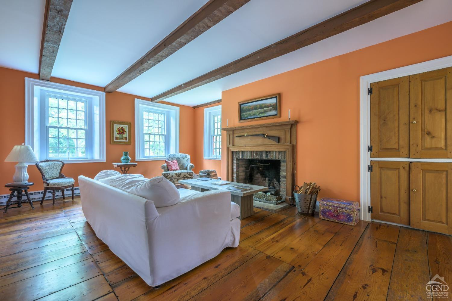 2221 Highway 9 Kinderhook, NY 12106 - Photo 11 of 41 a living room with furniture and a fireplace