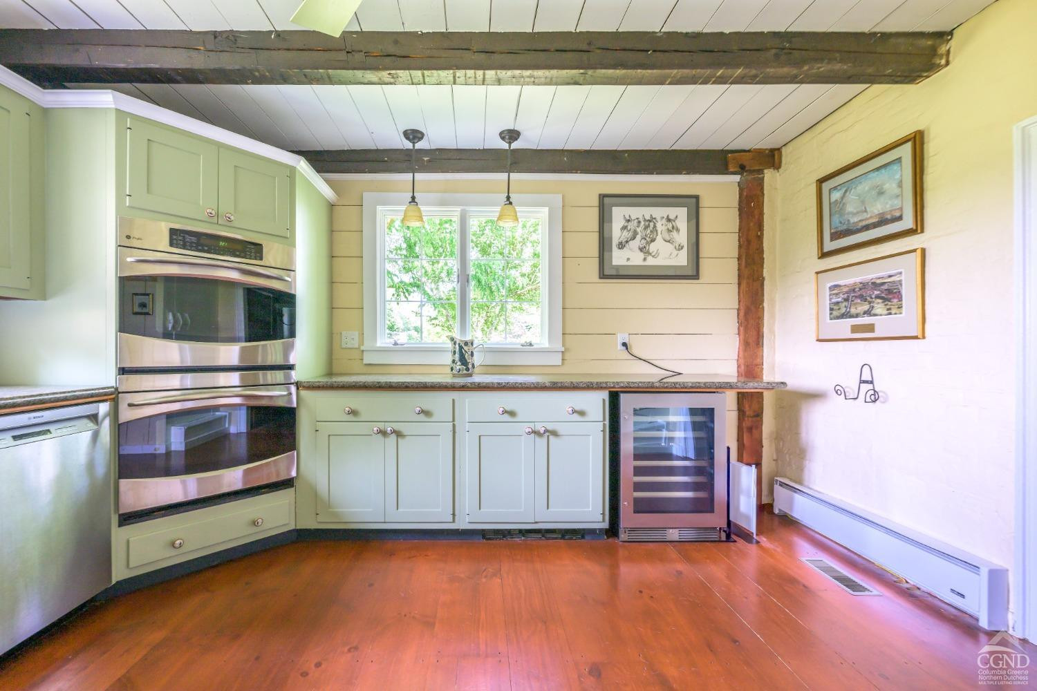 2221 Highway 9 Kinderhook, NY 12106 - Photo 14 of 41 a kitchen with granite countertop a stove and cabinets