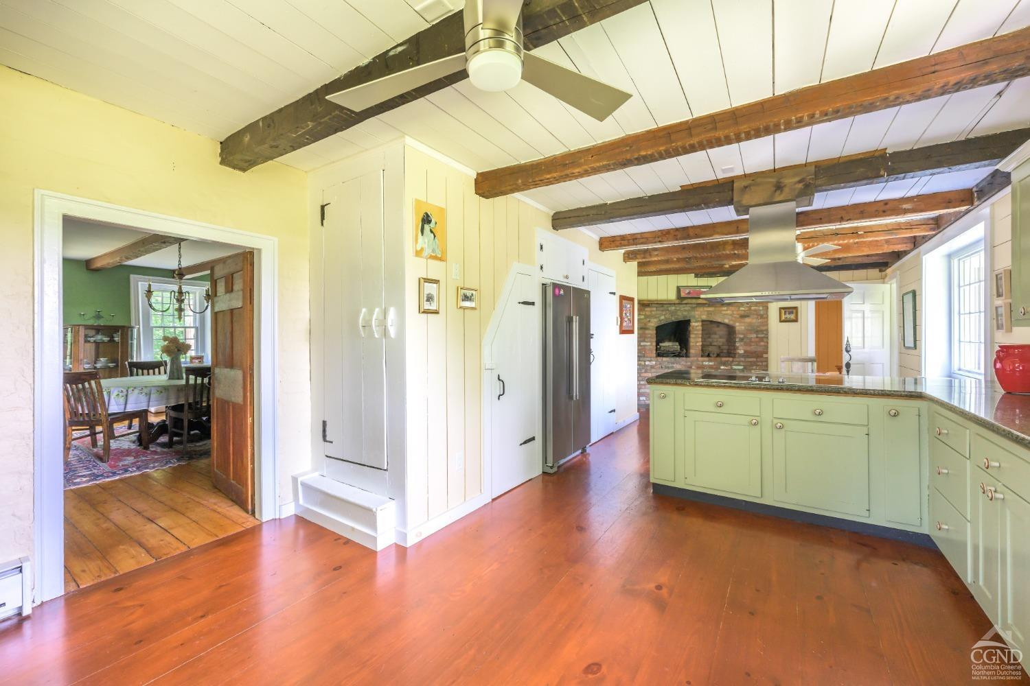 2221 Highway 9 Kinderhook, NY 12106 - Photo 15 of 41 a view of a hallway with wooden floor and a bathroom