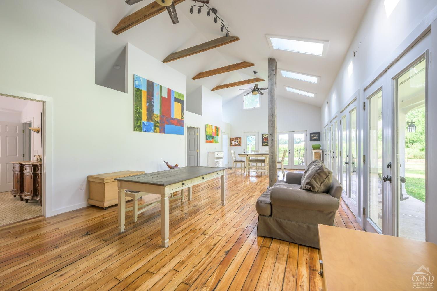 2221 Highway 9 Kinderhook, NY 12106 - Photo 17 of 41 a living room with furniture and a wooden floor