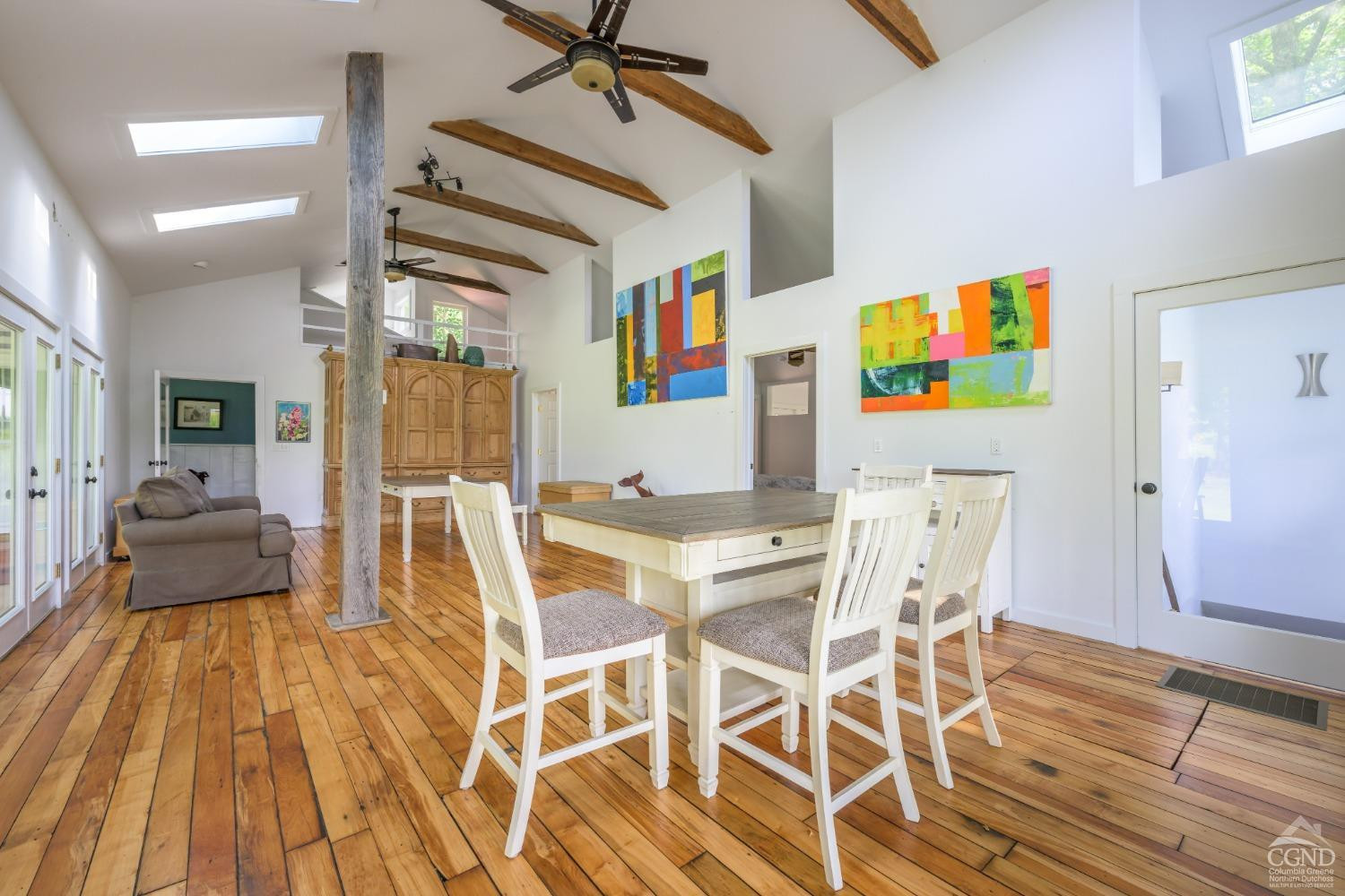 2221 Highway 9 Kinderhook, NY 12106 - Photo 19 of 41 a view of a dining room with furniture and wooden floor