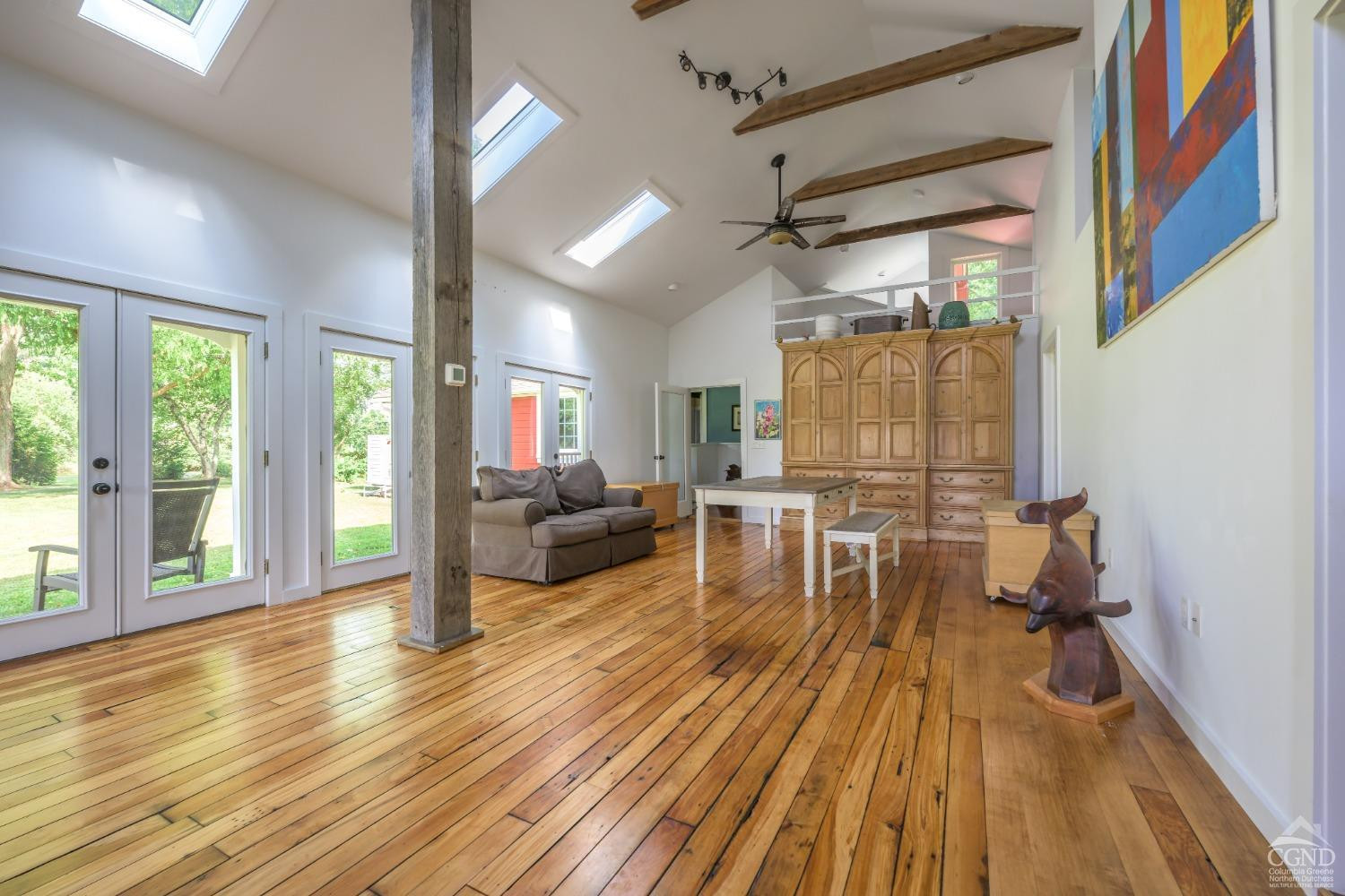 2221 Highway 9 Kinderhook, NY 12106 - Photo 20 of 41 a living room with furniture and a wooden floor