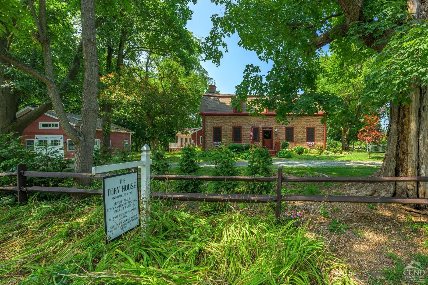 2221 Highway 9 Kinderhook, NY 12106 - Photo 2 of 41 a front view of a house with a yard