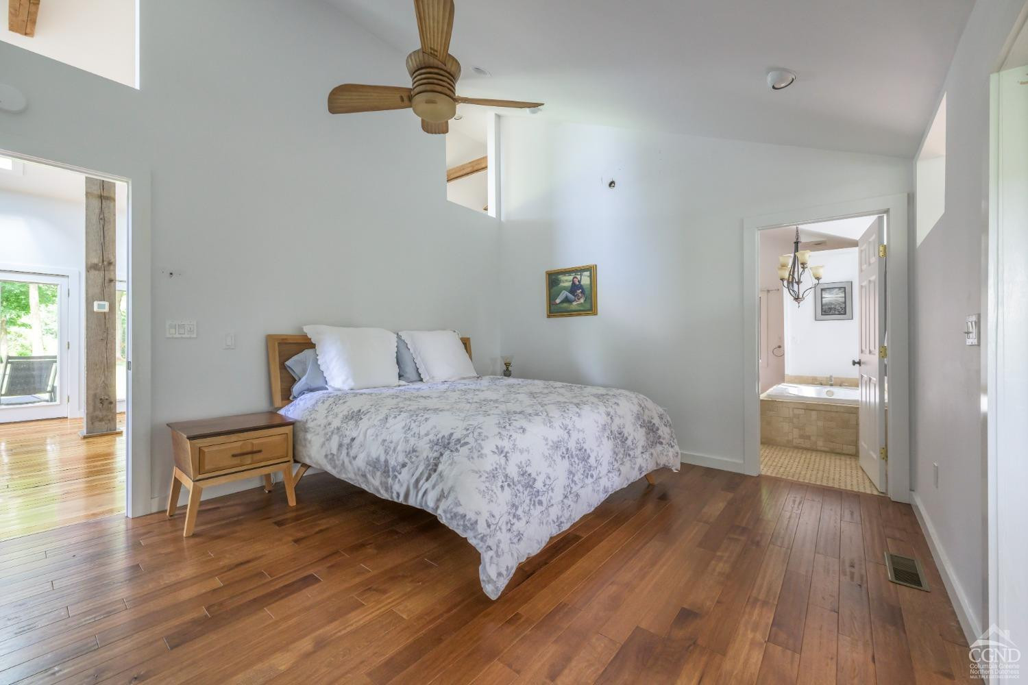 2221 Highway 9 Kinderhook, NY 12106 - Photo 21 of 41 a bedroom with a bed and wooden floor