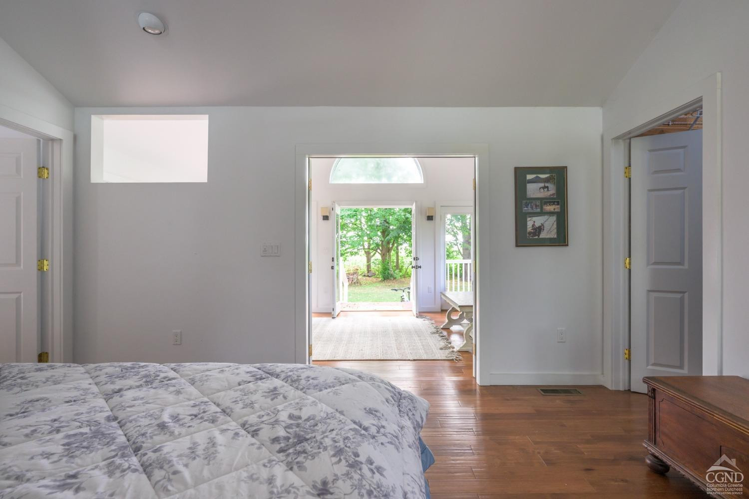 2221 Highway 9 Kinderhook, NY 12106 - Photo 24 of 41 a view of a bedroom with wooden floor and a window