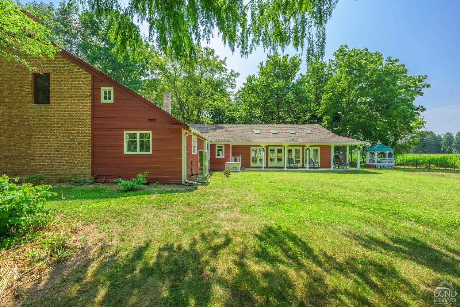2221 Highway 9 Kinderhook, NY 12106 - Photo 6 of 41 a front view of a house with garden