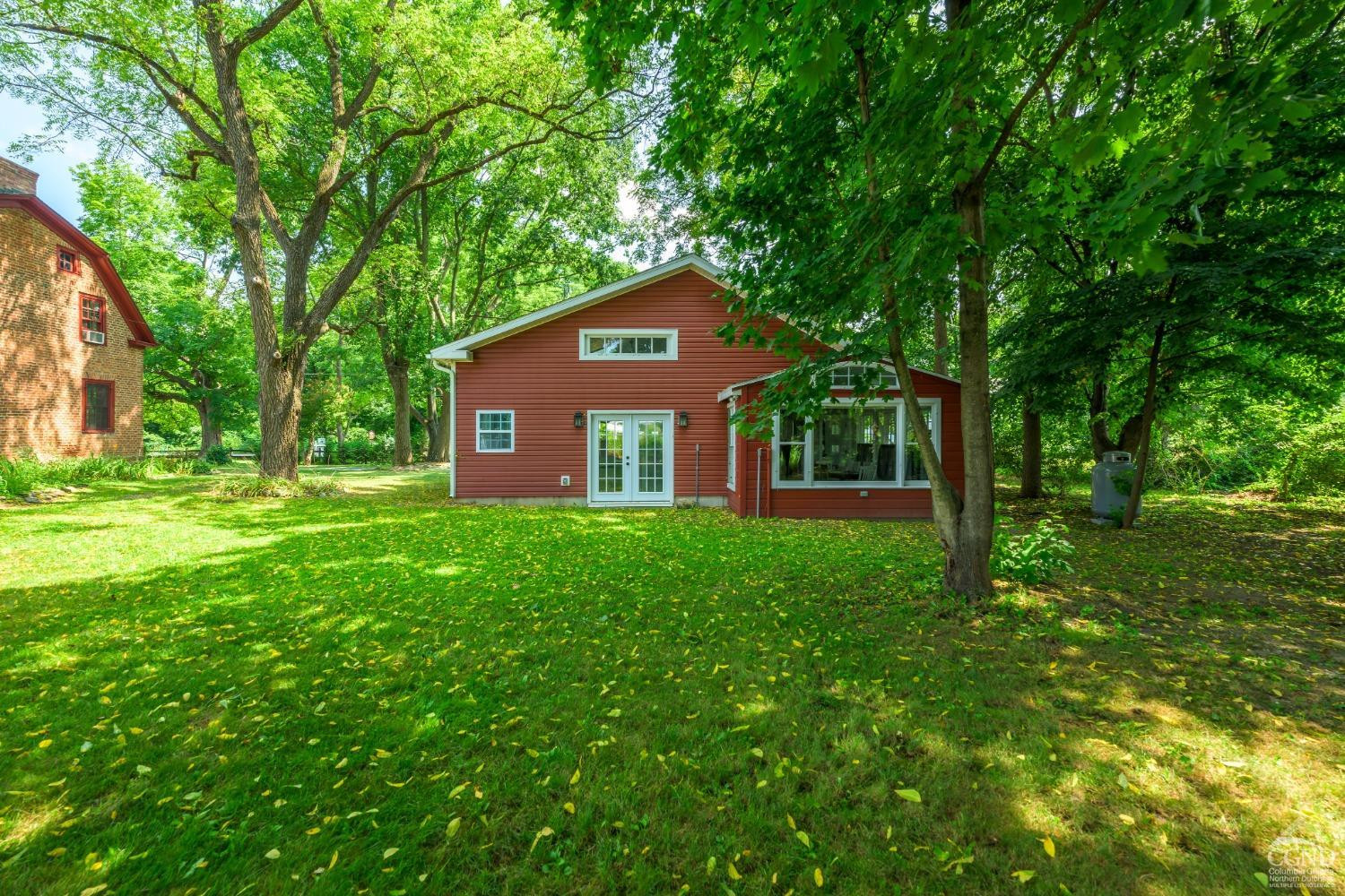 2221 Highway 9 Kinderhook, NY 12106 - Photo 7 of 41 a front view of a house with a yard
