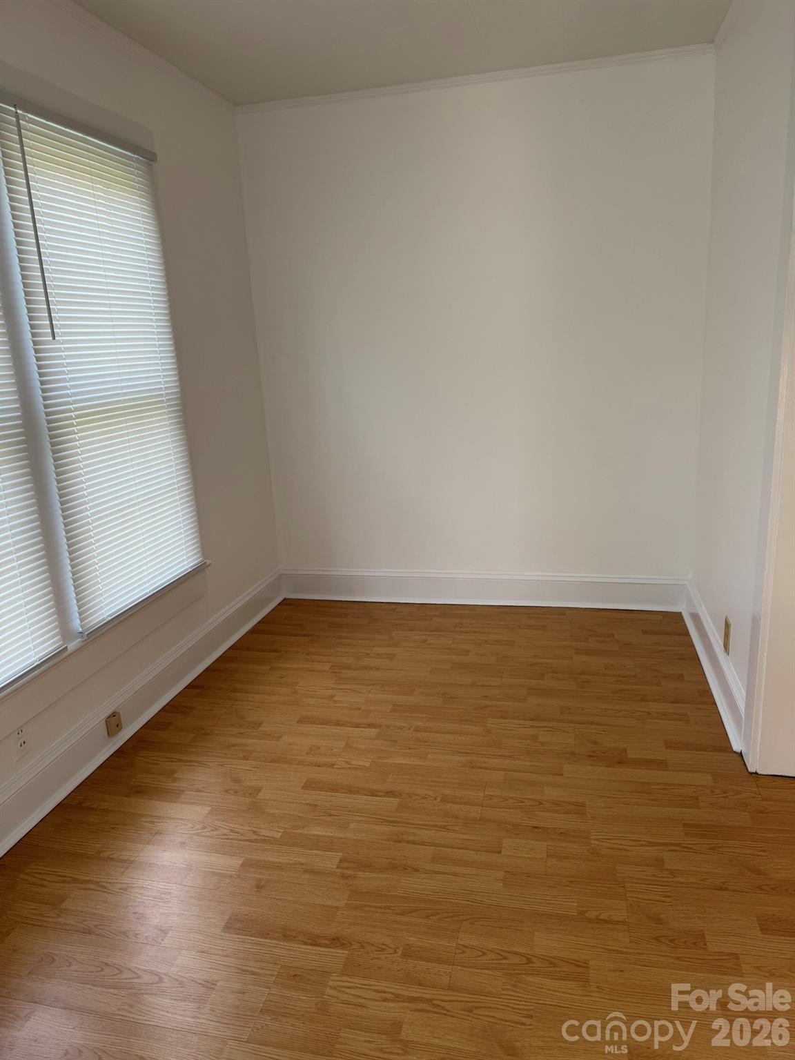 108 Fletcher Street Morganton, NC 28655 - Photo 7 of 29 a view of an empty room and wooden floor