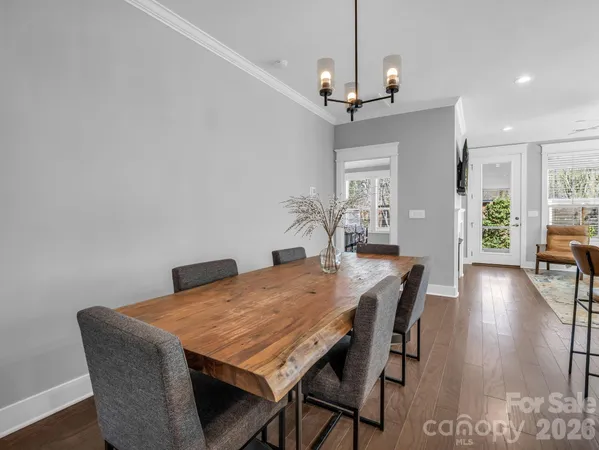 a large kitchen with a table and chairs
