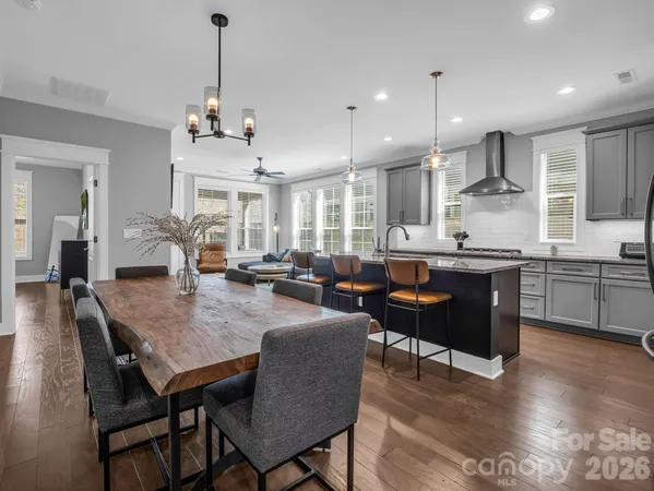 a bedroom with a bed and a flat tv screen on a dresser