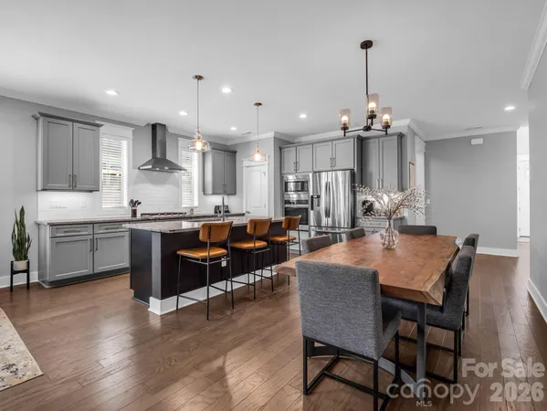 a bedroom with a bed and a lamp on table