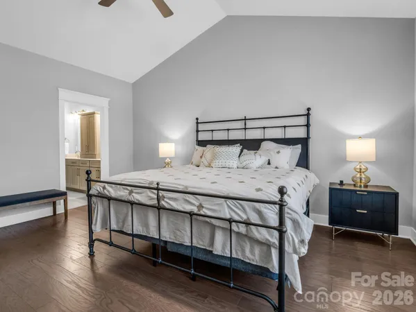 a bathroom with double vanity and a mirror