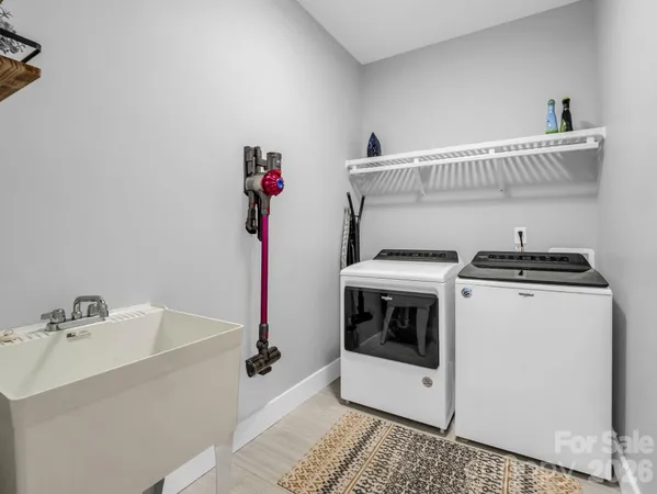 a living room filled with furniture and a large window