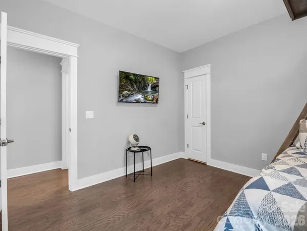 a white toilet sitting next to a bath tub