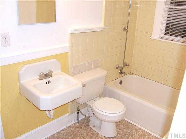 508 Phelps Avenue Raleigh, NC 27607 - Photo 3 of 7 a bathroom with a sink a toilet and bathtub