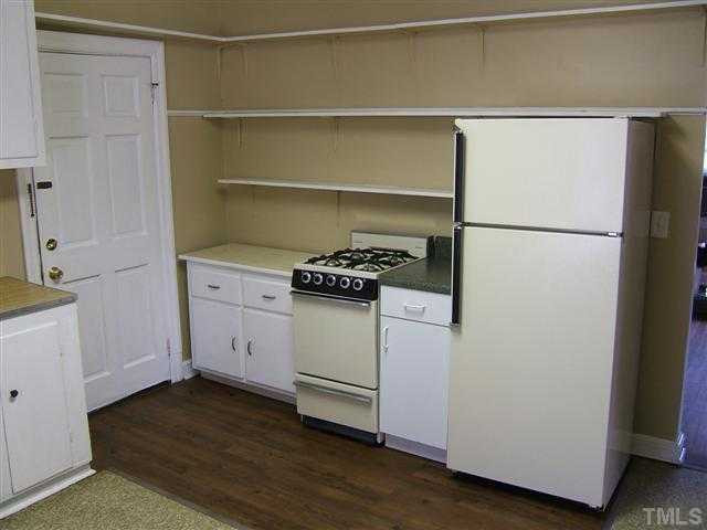 508 Phelps Avenue Raleigh, NC 27607 - Photo 6 of 7 a kitchen with a refrigerator and a stove