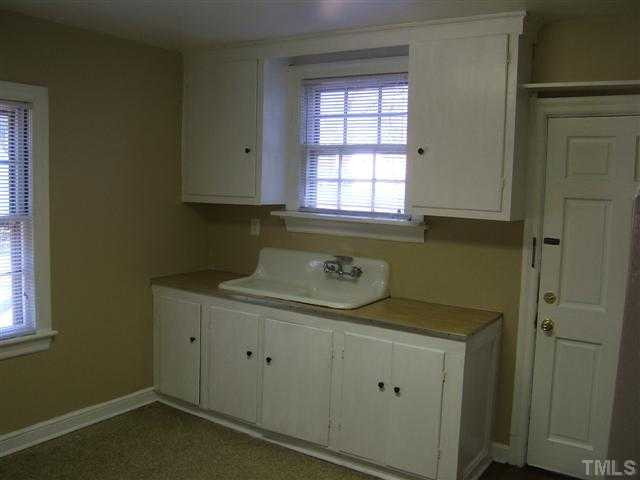 508 Phelps Avenue Raleigh, NC 27607 - Photo 7 of 7 a bathroom with a sink toilet and window