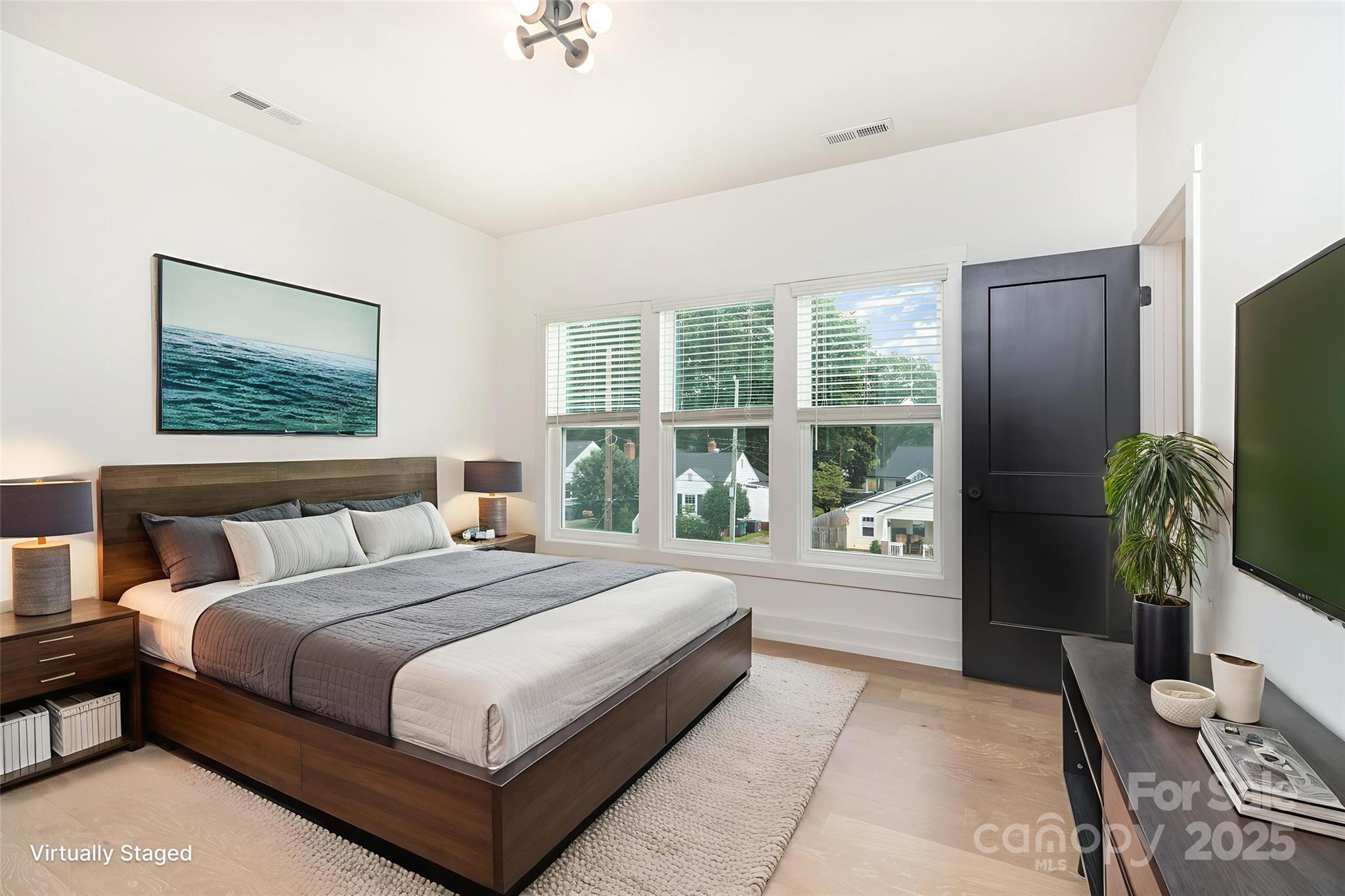 1500 Effingham Road Charlotte, NC 28208 - Photo 14 of 32 a bedroom with a large bed and a large window