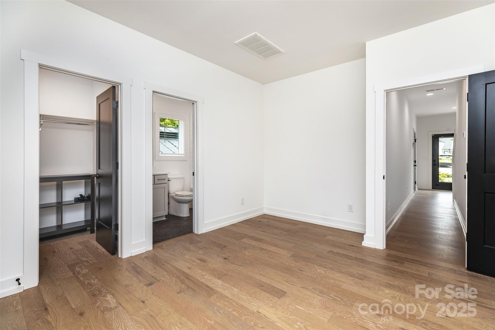 1500 Effingham Road Charlotte, NC 28208 - Photo 24 of 32 a view of empty room with wooden floor