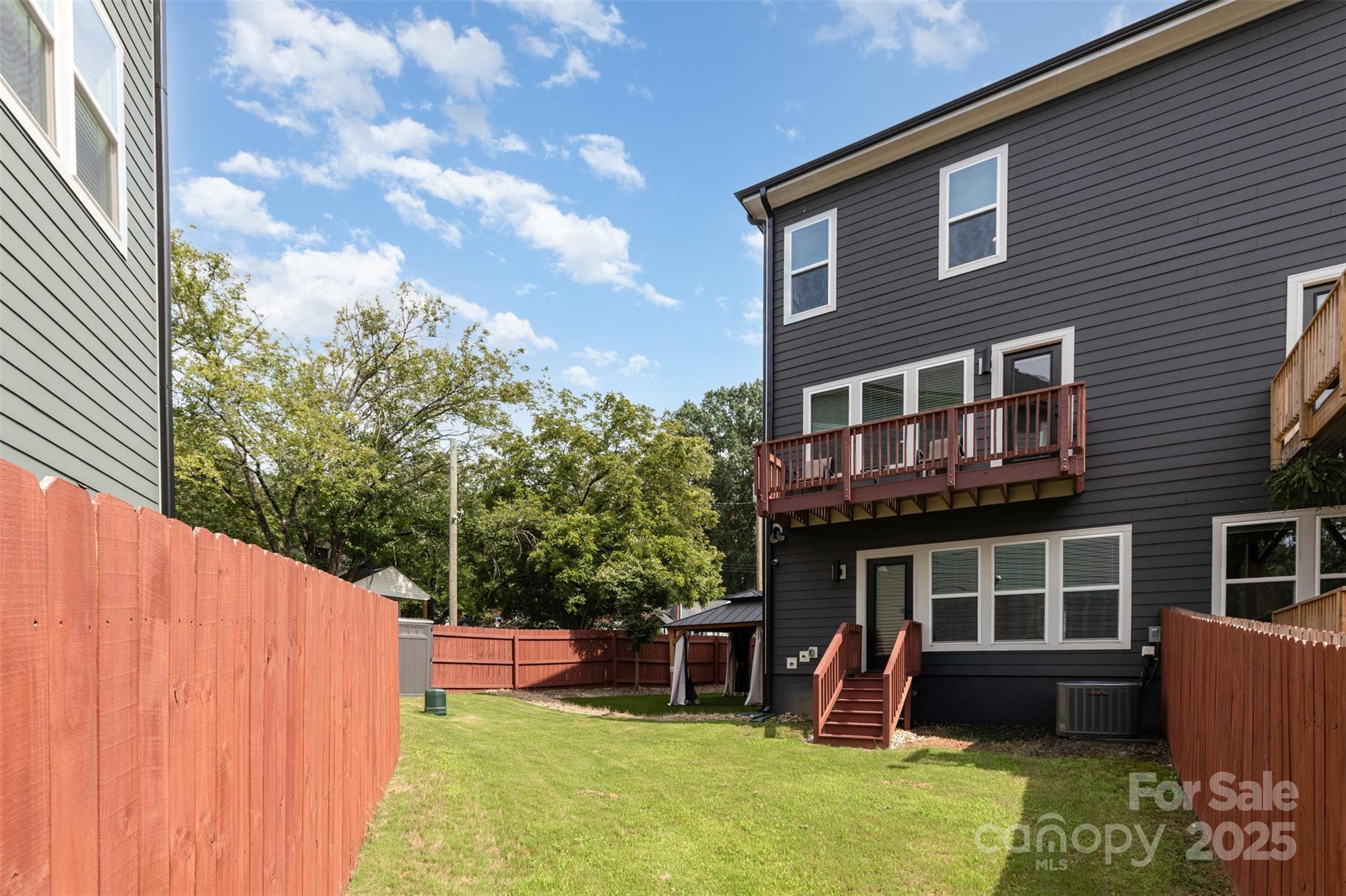 1500 Effingham Road Charlotte, NC 28208 - Photo 28 of 32 a view of a house with a yard patio and a patio