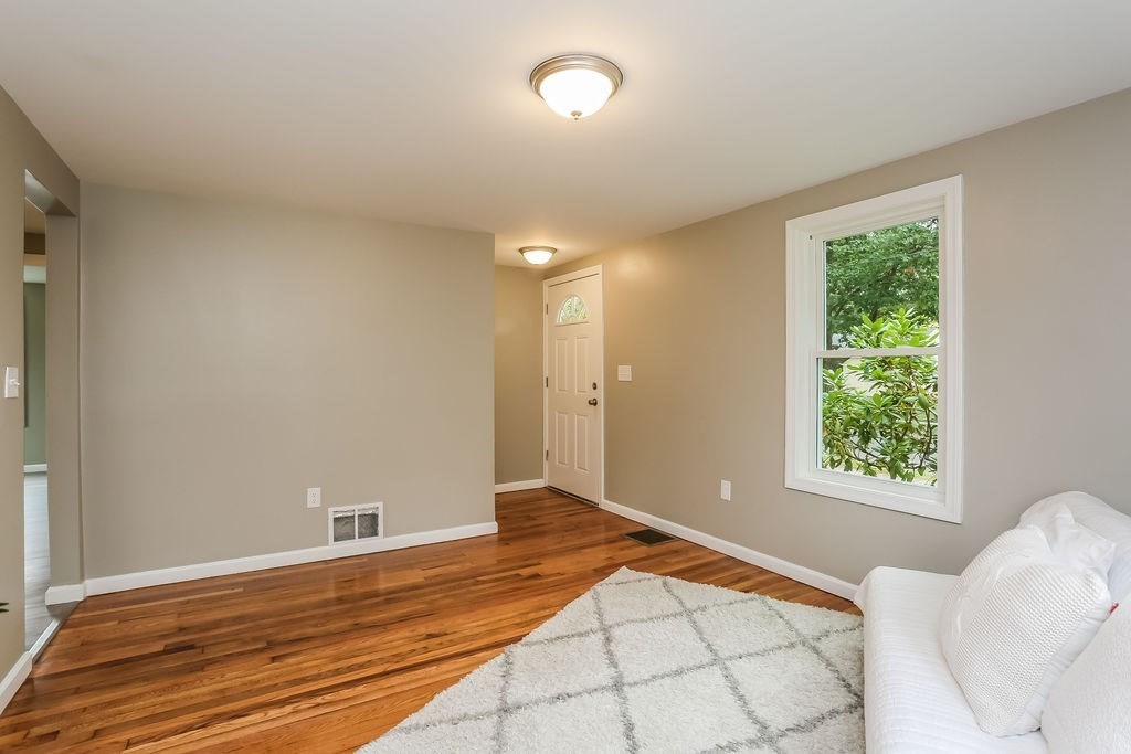 251 Edendale Street Springfield, MA 01104 - Photo 12 of 22 a view of a room with wooden floor and chair