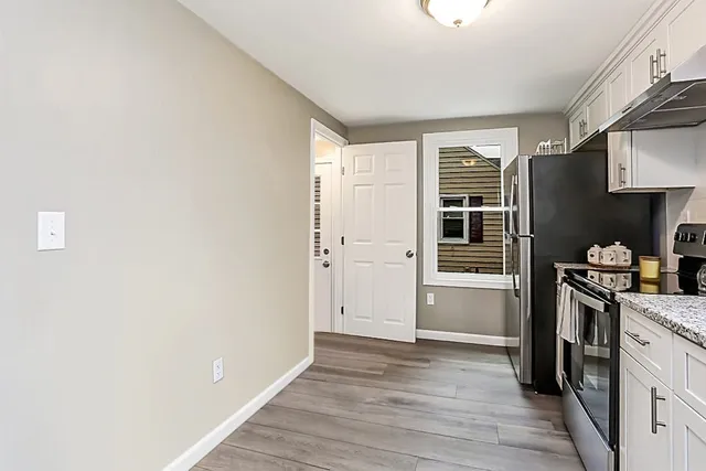 a kitchen with cabinets and stainless steel appliances