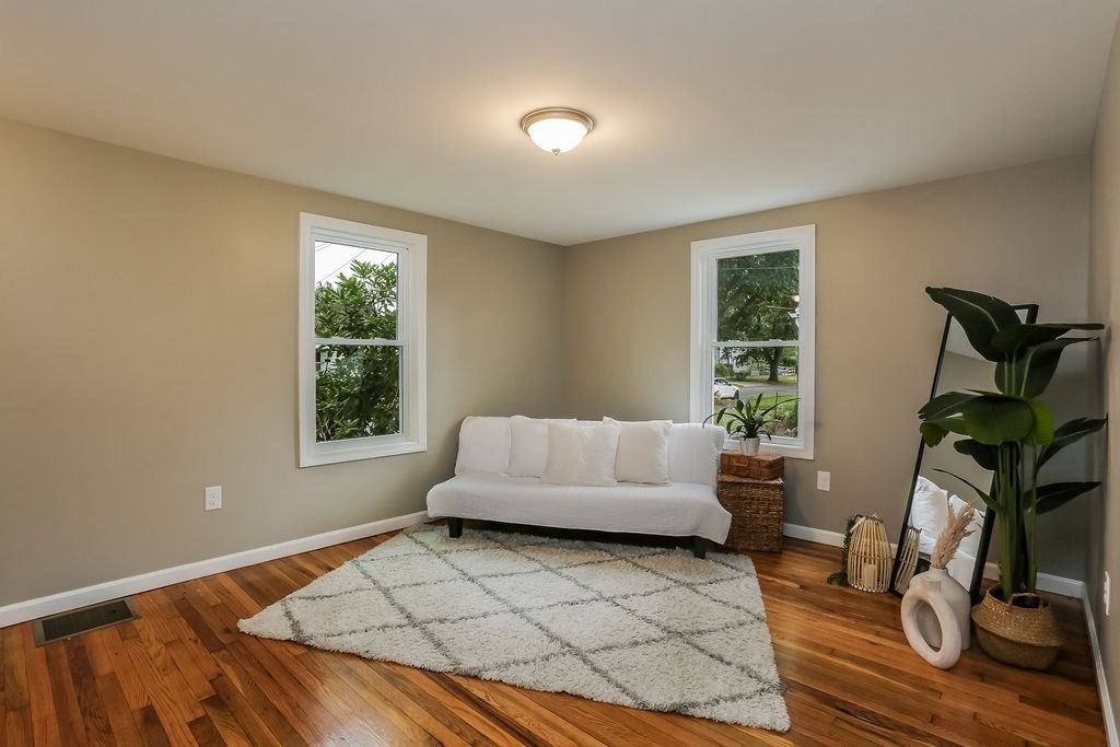 251 Edendale Street Springfield, MA 01104 - Photo 10 of 22 a living room with furniture and a window