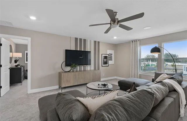 a bedroom with a bed and a television