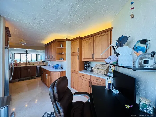 a bedroom with furniture and a flat screen tv