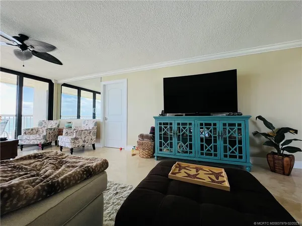 a view of a balcony with furniture