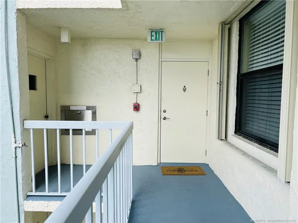a kitchen with cabinets and window