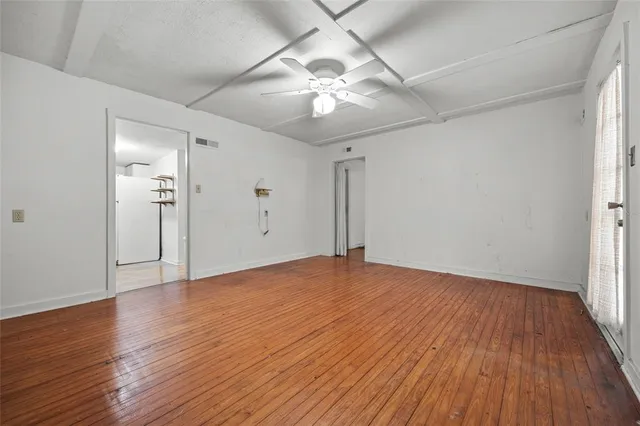 a kitchen with wooden cabinets and sink