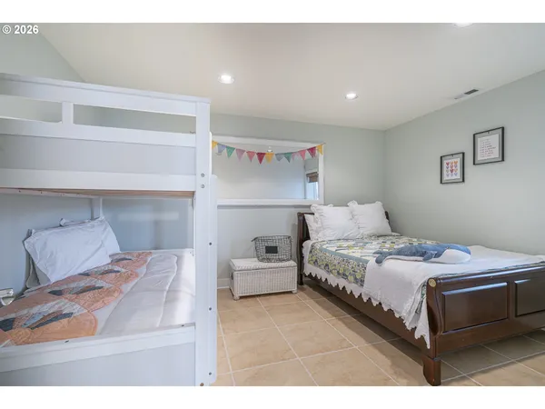 a bedroom with a bed and a view of bedroom