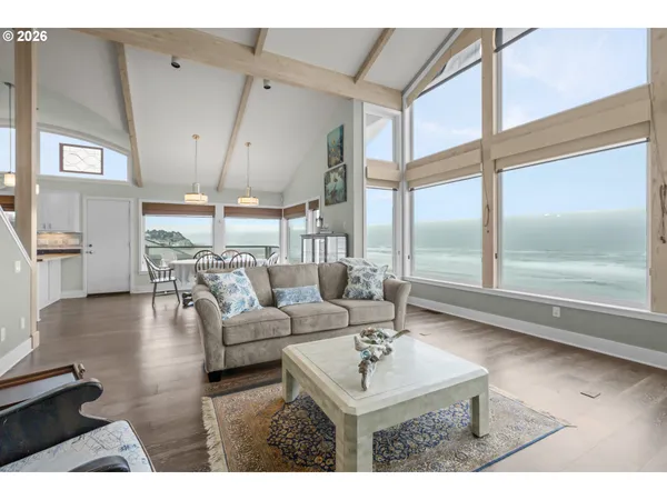 a kitchen with stainless steel appliances granite countertop a refrigerator a stove microwave and a sink