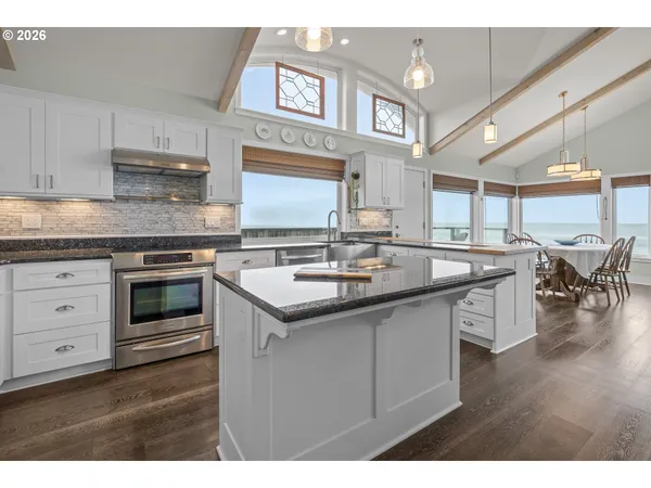 a view of a dining room with furniture and window
