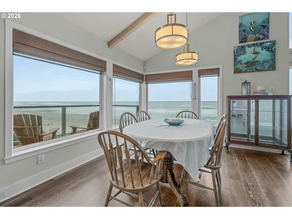 a dining room with furniture and wooden floor