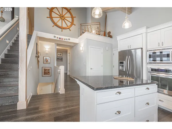 a view of cabinets wooden floor and a living room