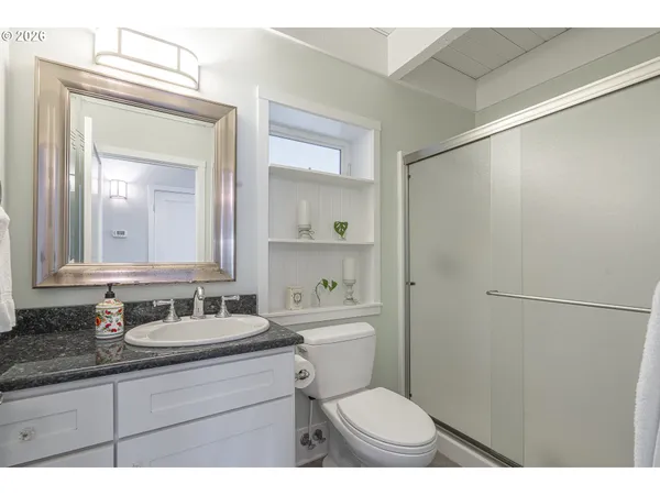 a spacious bedroom with a bed and window