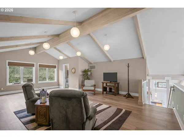 a bedroom with a large bed and a dresser