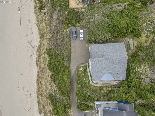 an aerial view of residential house with beach