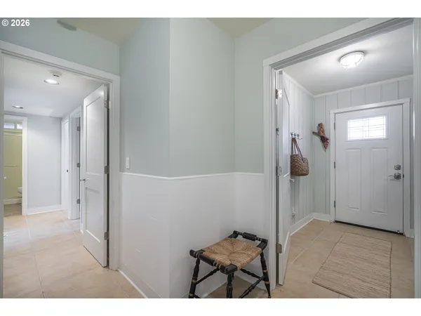 a bathroom with a granite countertop sink a toilet a mirror and shower
