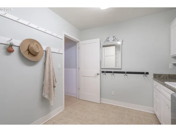 a kitchen with a sink cabinets and a window