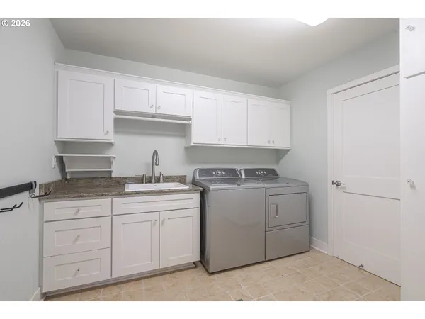 a bathroom with a sink toilet and a mirror