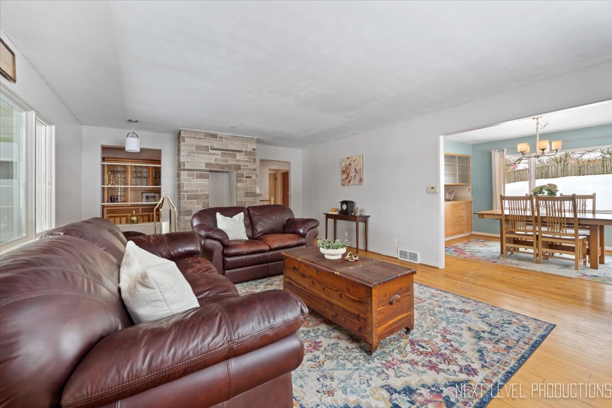 38W443 Sunset Drive St. Charles, IL 60175 - Photo 12 of 33 a living room with furniture and a rug